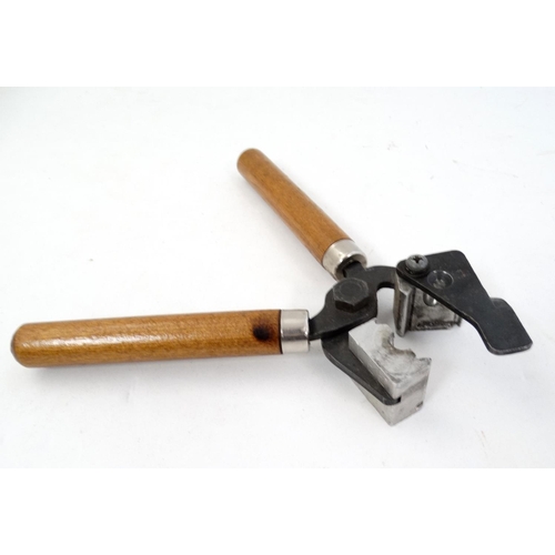 586 - Shooting : A hand-held Bullet mould , having plier action with hardwood grip . 8'' long