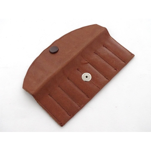 588 - Shooting: A set of 8 - peg brass position finders, in a tan leather case, the pegs 1 3/4'' long