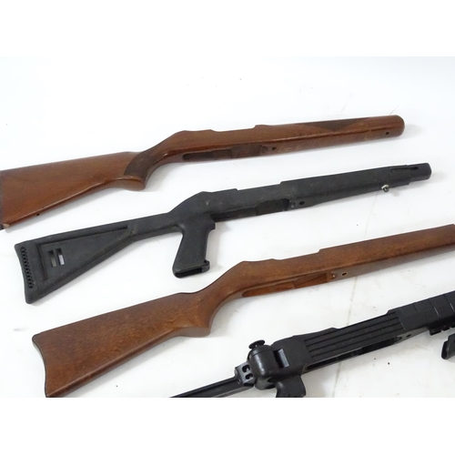 589 - Shooting: An assortment of Ruger 10/22 rifle stocks, to include both wooden and tactical / folding e... 