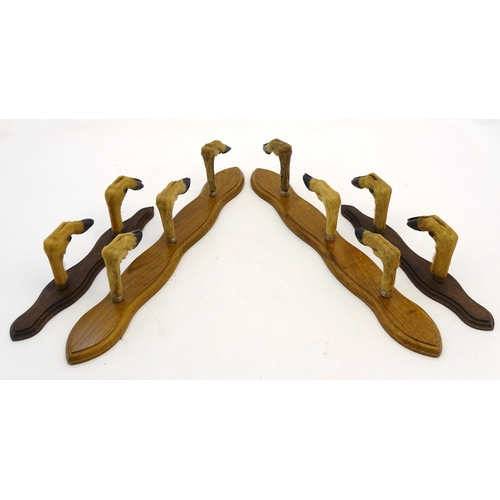 59 - Taxidermy: A continental mounted roe deer hoof gun rack for three guns, together with another for tw... 