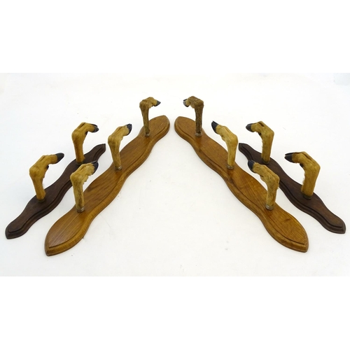 59 - Taxidermy: A continental mounted roe deer hoof gun rack for three guns, together with another for tw... 