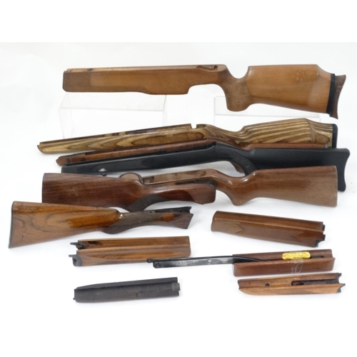 590 - Shooting : A quantity of assorted rimfire , centrefire and airgun stocks , to include walnut , compo... 