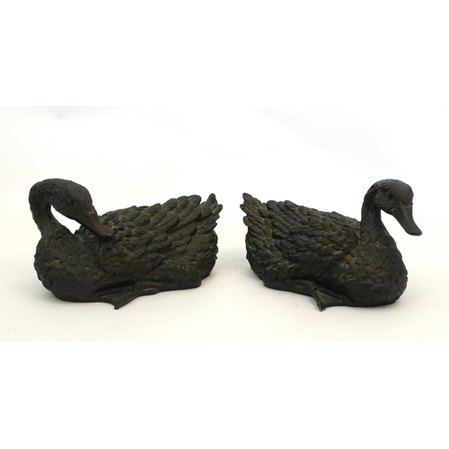 67 - A pair of highly detailed composite garden models of domestic duck, the largest 13 1/2'' long