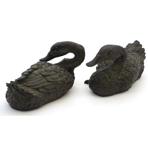 67 - A pair of highly detailed composite garden models of domestic duck, the largest 13 1/2'' long