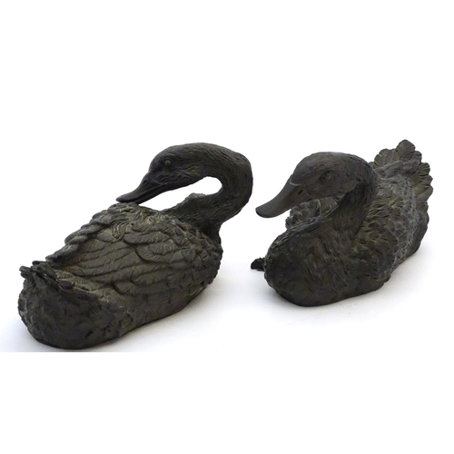 67 - A pair of highly detailed composite garden models of domestic duck, the largest 13 1/2'' long