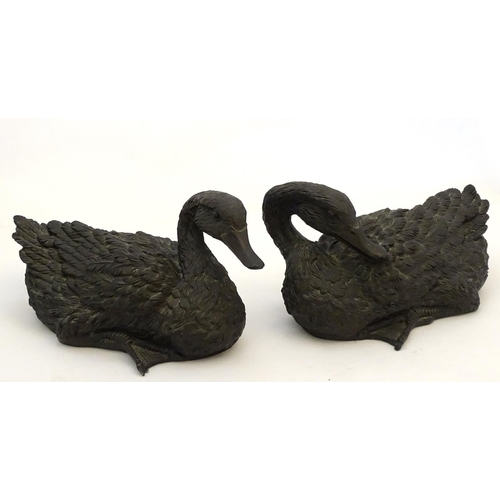 67 - A pair of highly detailed composite garden models of domestic duck, the largest 13 1/2'' long