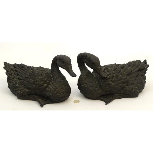 67 - A pair of highly detailed composite garden models of domestic duck, the largest 13 1/2'' long