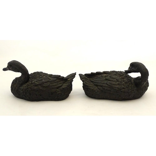 67 - A pair of highly detailed composite garden models of domestic duck, the largest 13 1/2'' long