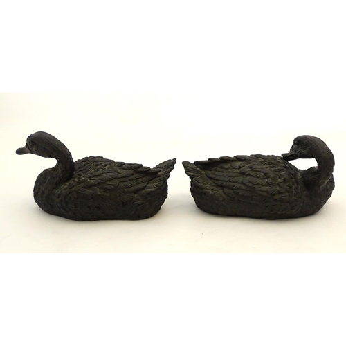 67 - A pair of highly detailed composite garden models of domestic duck, the largest 13 1/2'' long