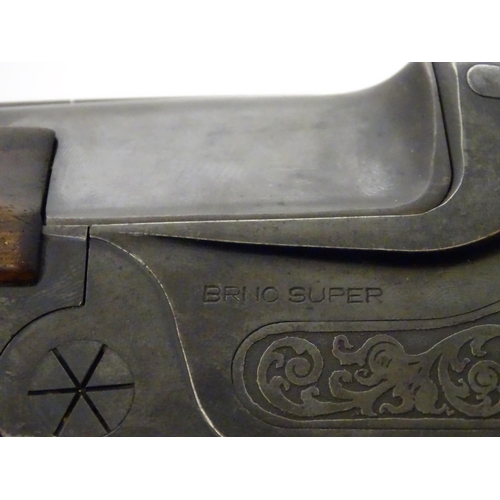 717 - Shotgun: The stock & action of a BRNO ' Super ' 12 bore over and under shotgun, the action engraved ... 