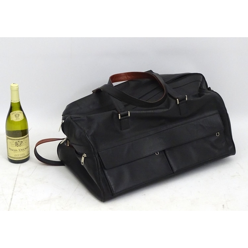 98 - A black leather weekend/ travel bag with strap with embossed Rolls Royce mark, 25 ½'' wide