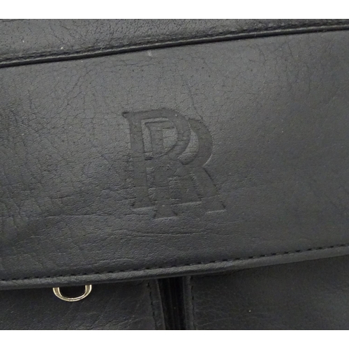 98 - A black leather weekend/ travel bag with strap with embossed Rolls Royce mark, 25 ½'' wide