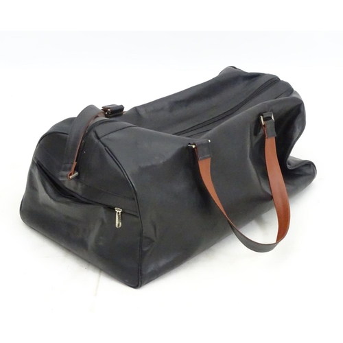 98 - A black leather weekend/ travel bag with strap with embossed Rolls Royce mark, 25 ½'' wide