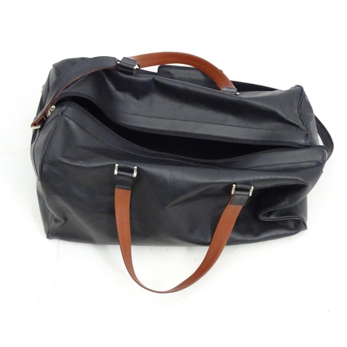 98 - A black leather weekend/ travel bag with strap with embossed Rolls Royce mark, 25 ½'' wide