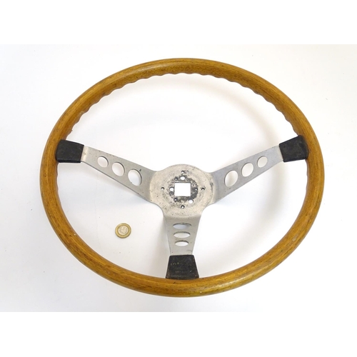 132 - A c1960s wooden and alloy steering wheel by Formula GT Britain, 15'' diameter, 4 1/2'' high