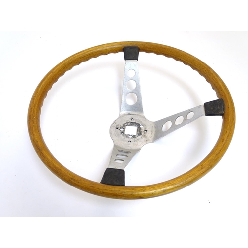 132 - A c1960s wooden and alloy steering wheel by Formula GT Britain, 15'' diameter, 4 1/2'' high