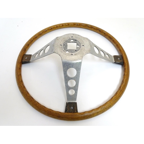 132 - A c1960s wooden and alloy steering wheel by Formula GT Britain, 15'' diameter, 4 1/2'' high