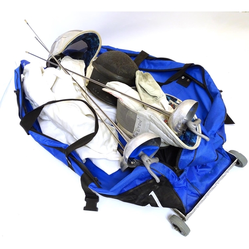 145 - A quantity of fencing equipment to include clothing, masks and foils by ' Uhlmann Fencing etc.