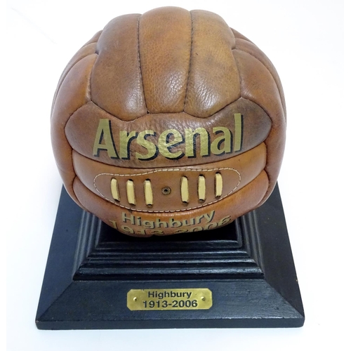 148 - A commemorative leather football on stand, ' Arsenal Highbury 1913-2006 '