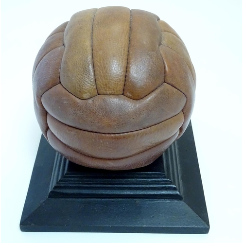 148 - A commemorative leather football on stand, ' Arsenal Highbury 1913-2006 '