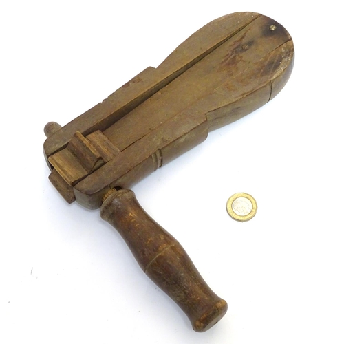 149 - An old wooden football rattle / claxon . Approx 9'' long