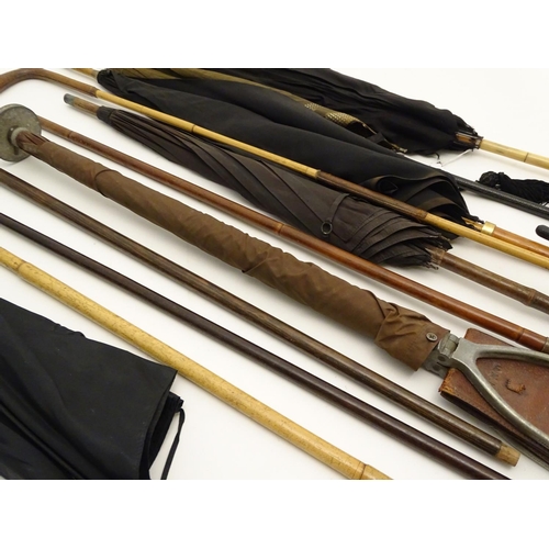 196 - A quantity of assorted sticks , umbrellas etc to include a horn handled cane with hallmarked silver ... 