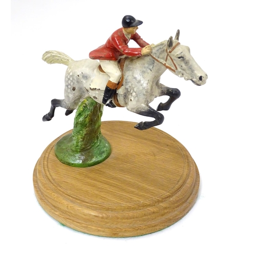 200 - A cold painted bronze car mascot formed as a horse and huntsman , now mounted on a wooden plinth. Ap... 