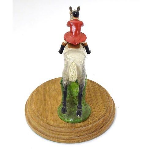 200 - A cold painted bronze car mascot formed as a horse and huntsman , now mounted on a wooden plinth. Ap... 