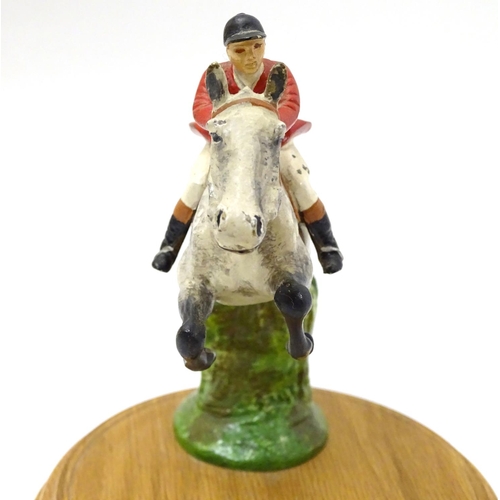 200 - A cold painted bronze car mascot formed as a horse and huntsman , now mounted on a wooden plinth. Ap... 