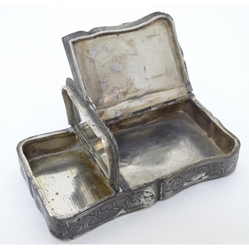 203 - A white metal 2-sectional snuff / tobacco box with acanthus scroll decoration, image of cup and pipe... 