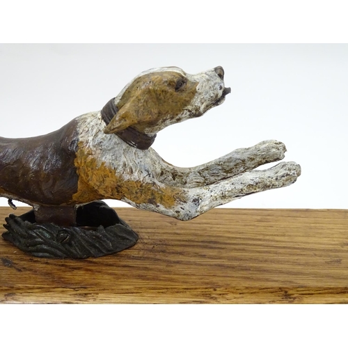 206 - A 21stC bronze desktop letter clip / paperweight formed as a cold painted figure of a running hound ... 