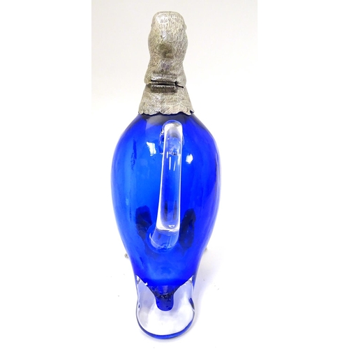 211 - A 21stC novelty claret jug formed as a duck with blue glass body, clear glass handle and silver plat... 