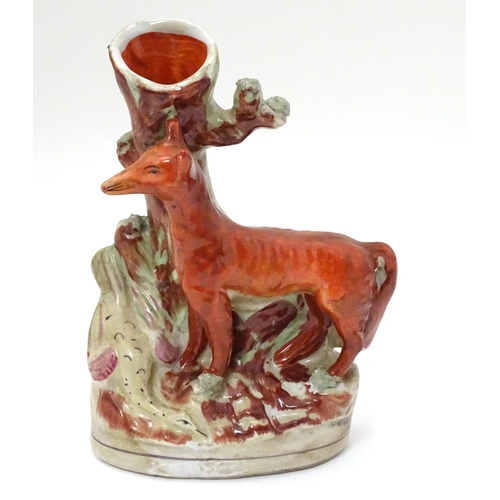 212 - A Staffordshire flat backed fox and game bird spill vase, 8'' high, 5 1/2'' wide