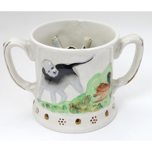 218 - A Staffordshire Loving Mug / Frog mug, depicting relief's of gun dogs and game birds across body and... 