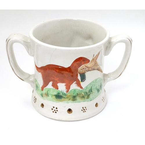 218 - A Staffordshire Loving Mug / Frog mug, depicting relief's of gun dogs and game birds across body and... 