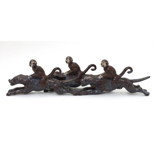 224 - A 21stC cold painted figure group formed as 3 monkeys riding 3 hound dogs. Approx 5'' long x 1 1/2''... 