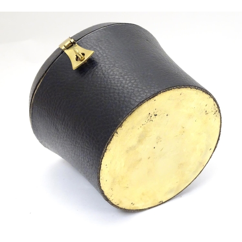 226 - A 21stC novelty brass caddy / container formed as a saddle shaped hat box with black leather coverin... 