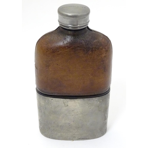 230 - A half leather covered hip flask with beaker to lower half. Marked G & JW Hawksley 5 1/4'' high