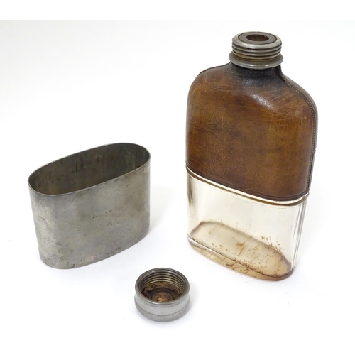 230 - A half leather covered hip flask with beaker to lower half. Marked G & JW Hawksley 5 1/4'' high