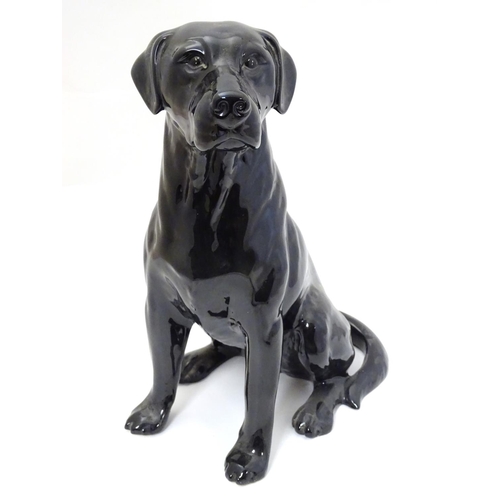 238 - A Beswick figure of a large fireside black Labrador dog no. 2314, makers mark impressed to base, 13'... 