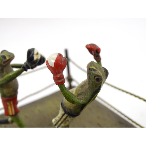 246 - A 21stC novelty cold painted bronze figure group formed as two frogs dressed as boxers within a boxi... 