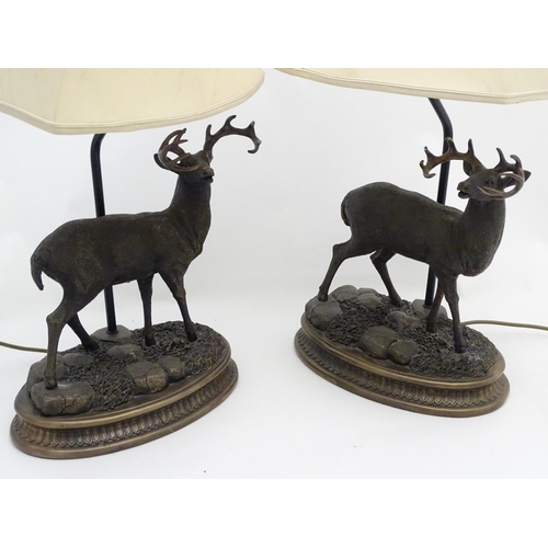 248 - A pair of late 20thC / 21stC table lamps, the bases with white-tail buck /stag decoration on ovoid b... 