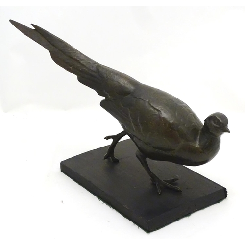 248A - A late 19th/ early 20thC patinated bronze model of a pheasant. Approx 18'' long x 11'' high