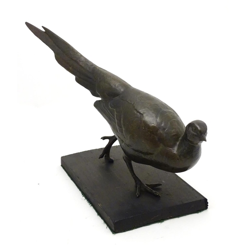 248A - A late 19th/ early 20thC patinated bronze model of a pheasant. Approx 18'' long x 11'' high