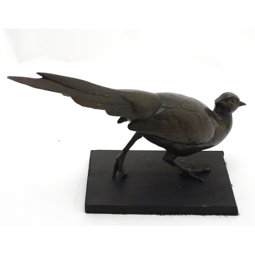 248A - A late 19th/ early 20thC patinated bronze model of a pheasant. Approx 18'' long x 11'' high