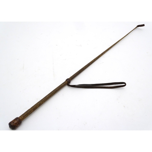 298 - An old riding crop. Approx 24'' long