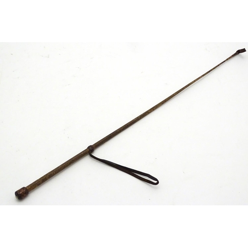 298 - An old riding crop. Approx 24'' long