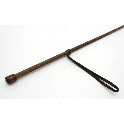 298 - An old riding crop. Approx 24'' long