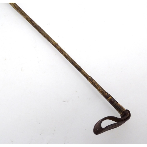 298 - An old riding crop. Approx 24'' long