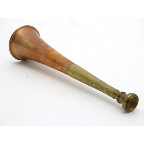 303 - A copper and brass short hunting horn. 8 1/2'' long